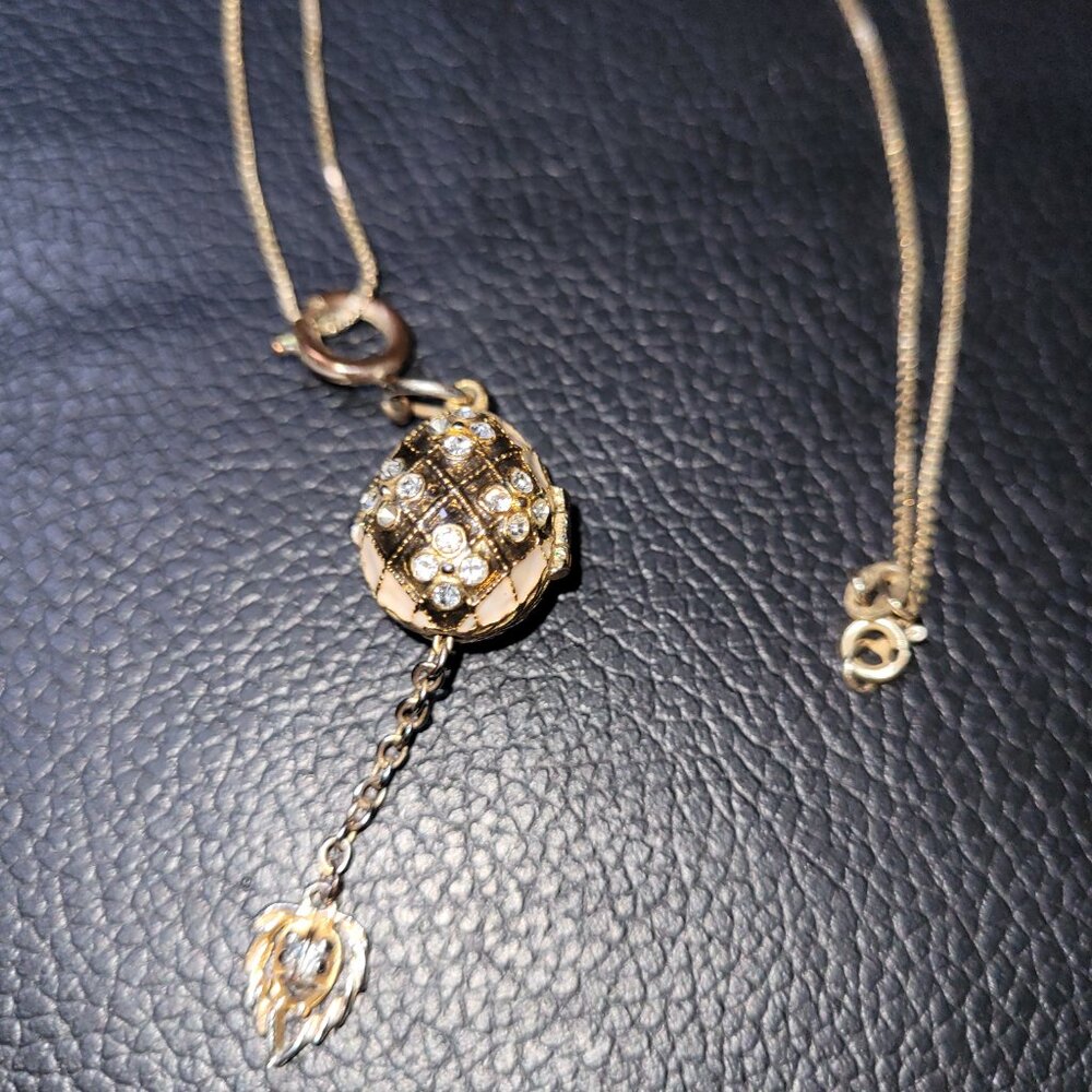 Egg Charm Locket on a Gold Chain Necklace